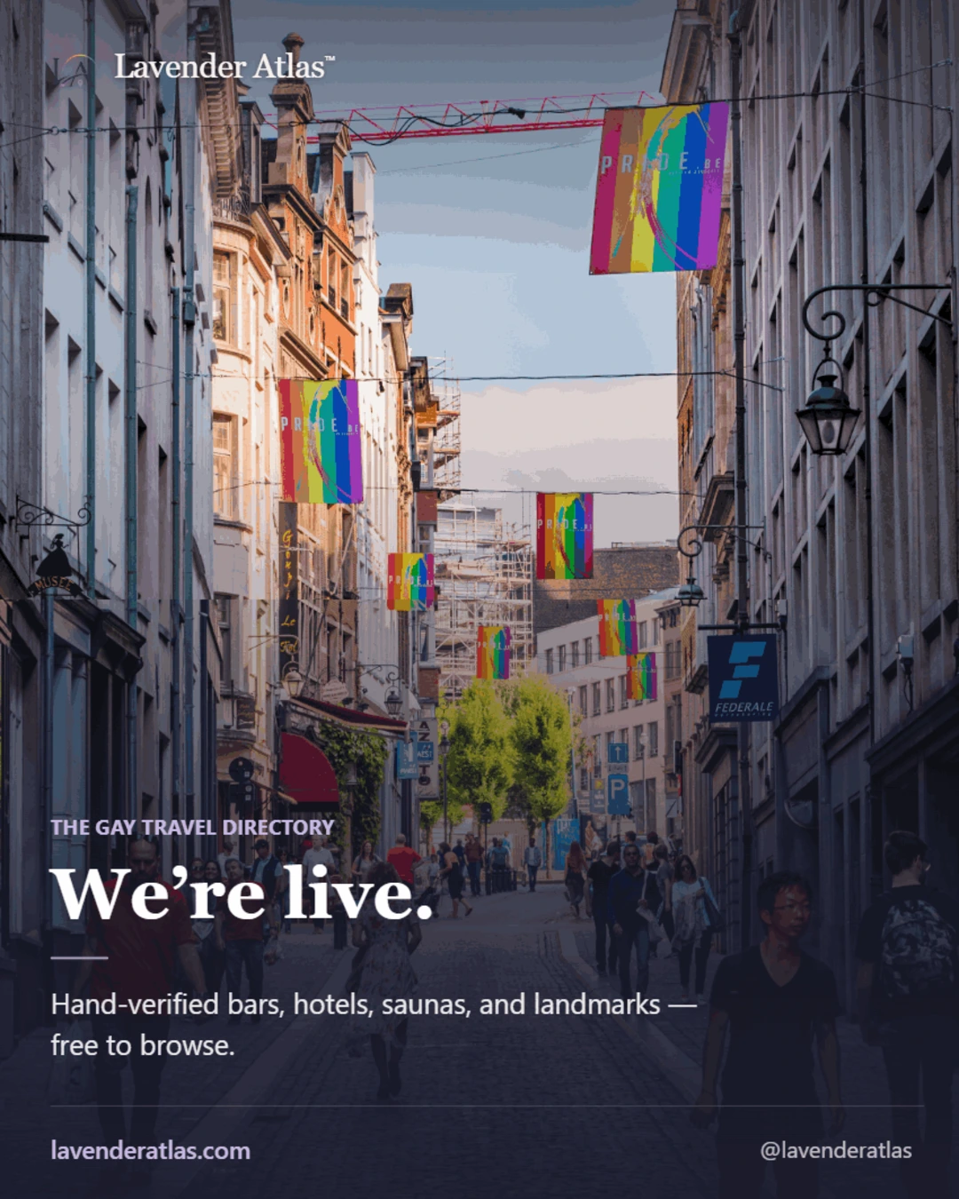 Rainbow Pride flags lining a European old-town street